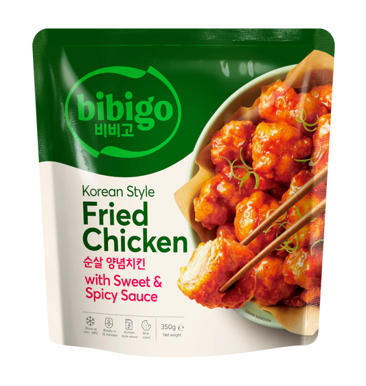 Packaging of bibigo Korean Style Fried Chicken with Sweet & Spicy Sauce on a clear background