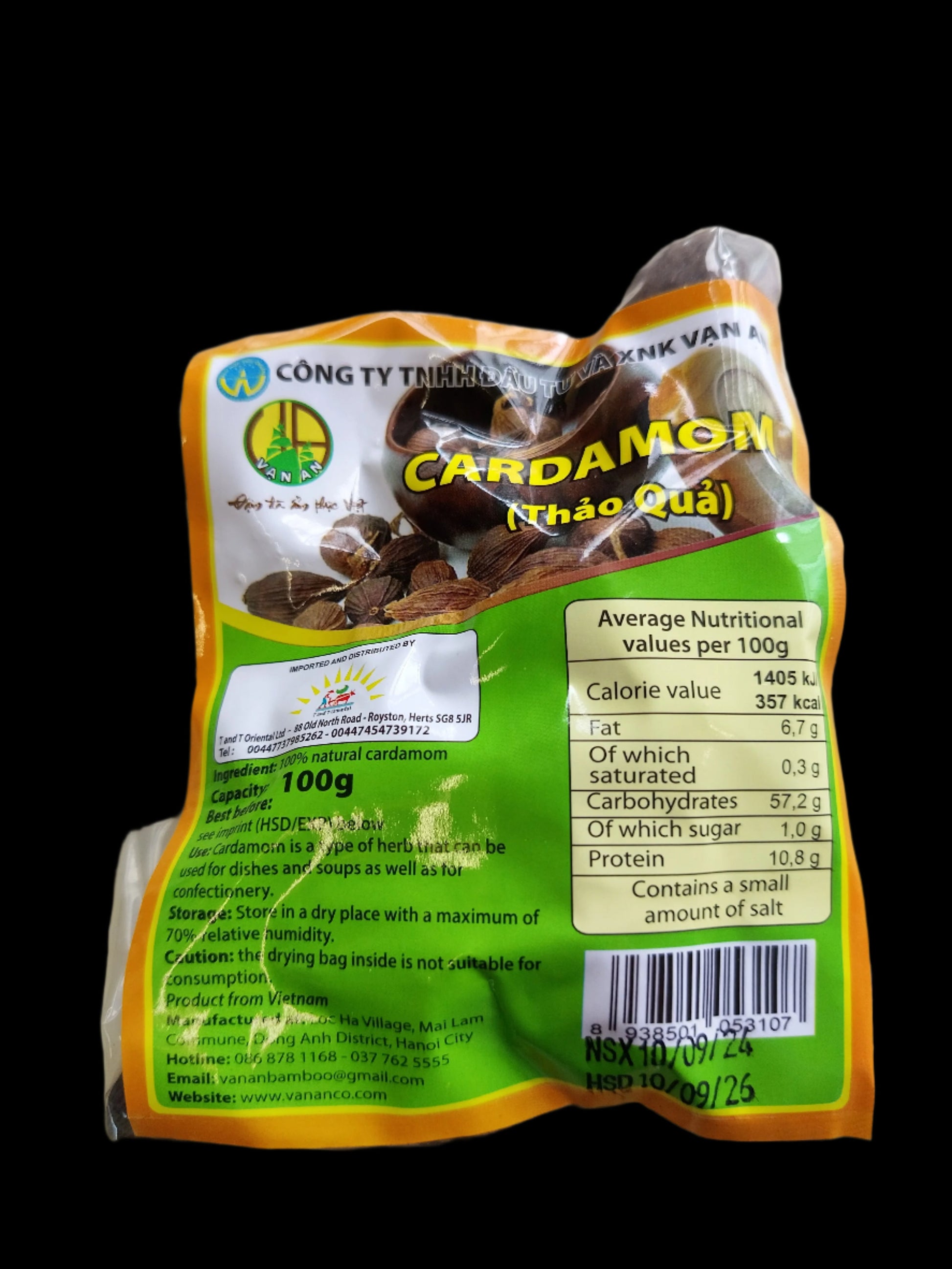 Packaged cardamom with a green label on a clear background