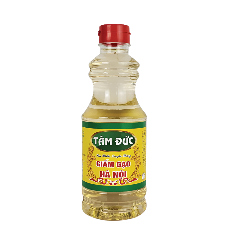 Bottle of Tam Duc rice vinegar with a yellow label on a white background
