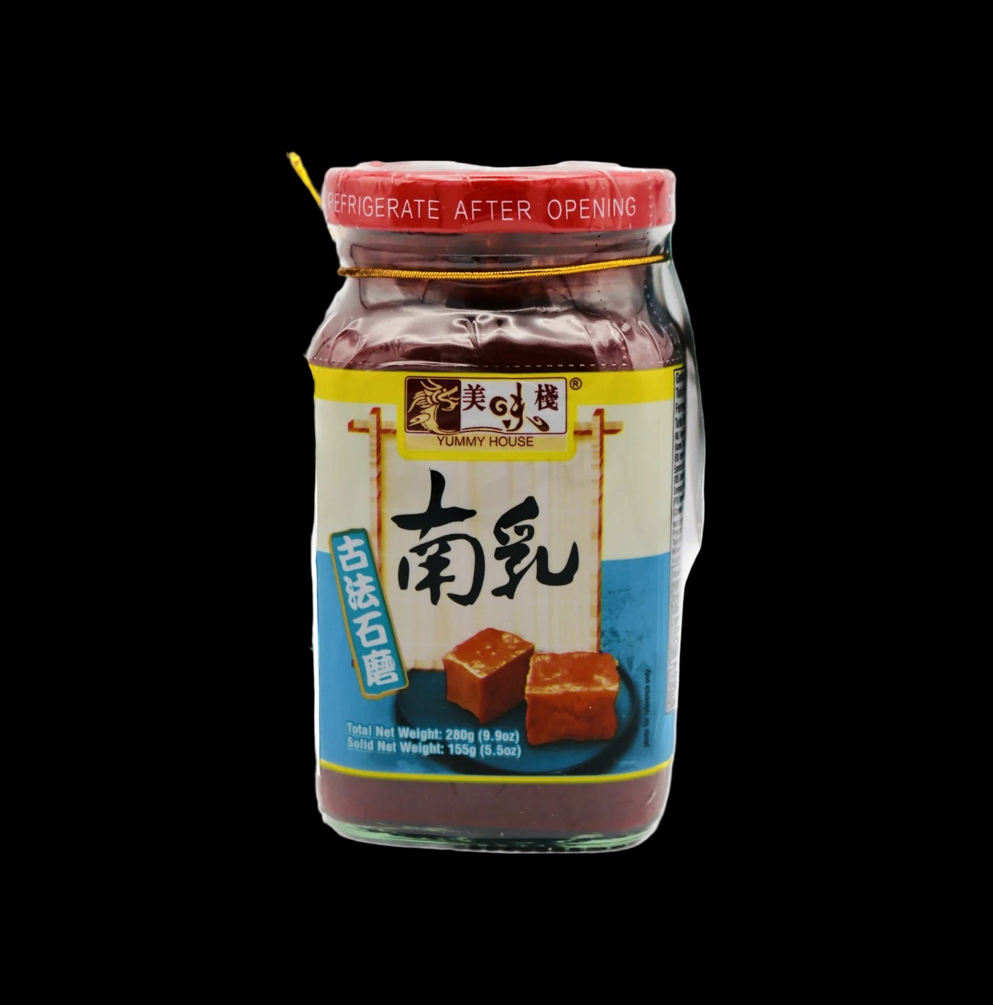 Jar of red bean paste with a yellow label on a black background