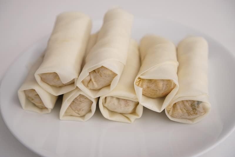 Rolls of spring rolls on a white plate